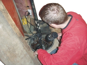 Mark Hendley inspecting a sump pump